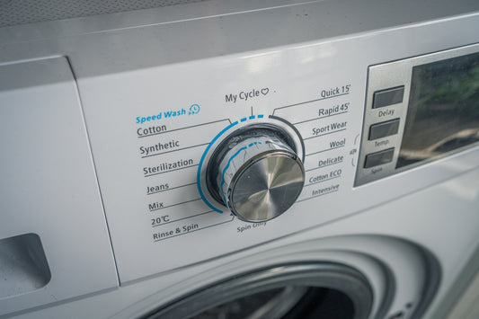 a close up of a washing machine with buttons