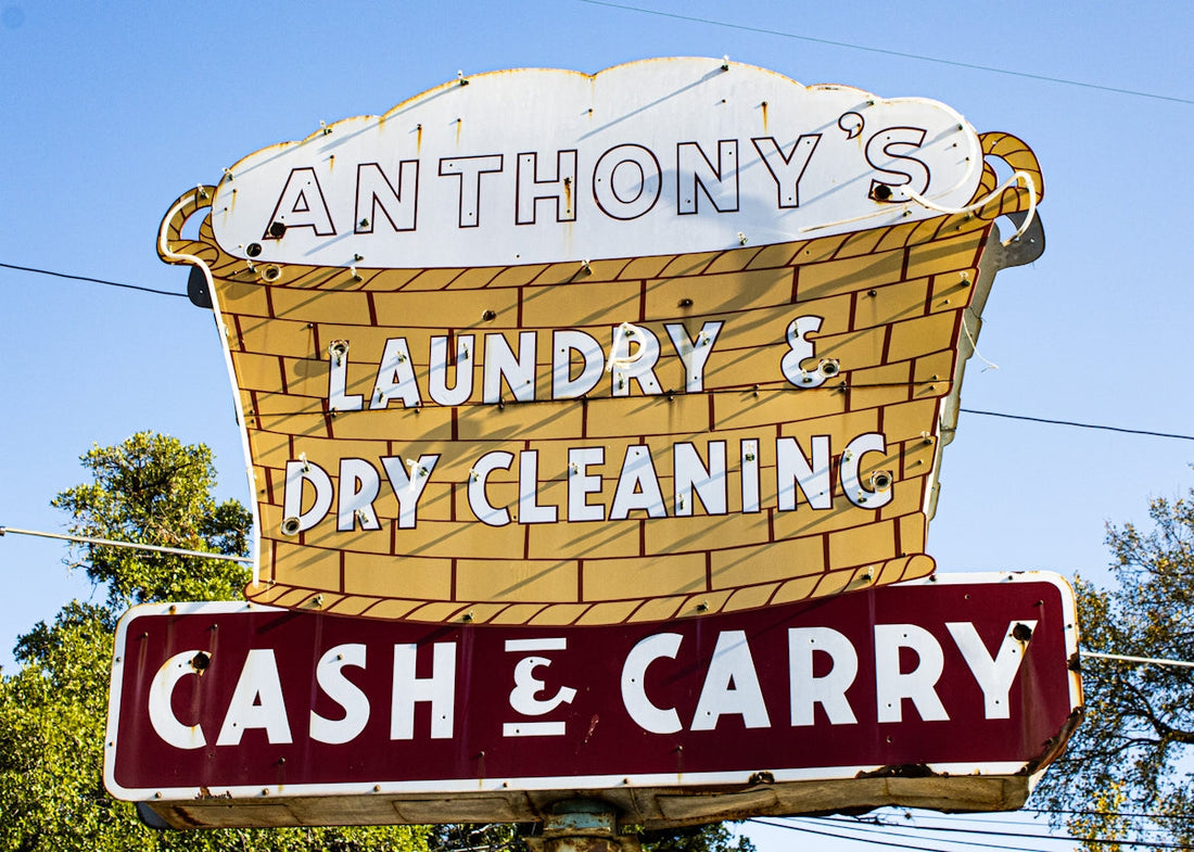A sign for a laundry and dry cleaning business