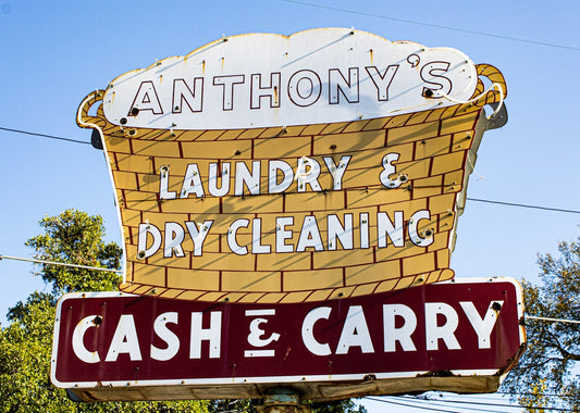 A sign for a laundry and dry cleaning business