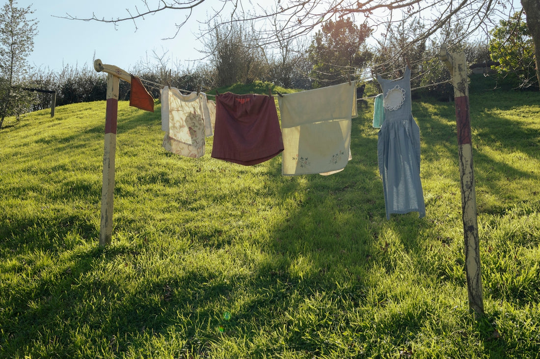 Laundry is drying on a clothesline outdoors.